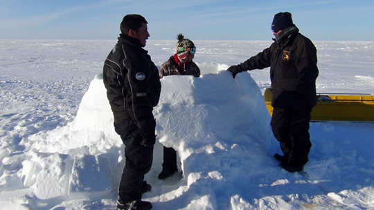 Building an igloo for a night on the tundra. Building an igloo for a night on the tundra.