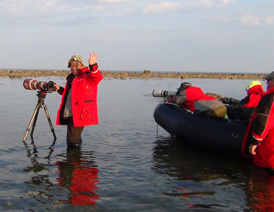 Xie Jianguo taking polar bear photos at Hubbard Point. Xie Jianguo of Birds Eye Media taking polar bear photos at Hubbard Point.